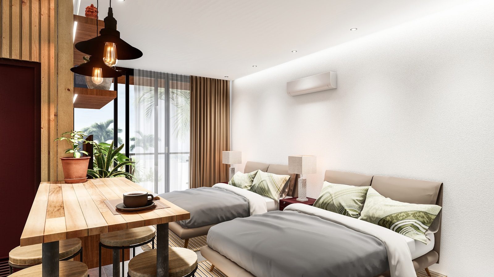 A bedroom with two beds and a wooden table